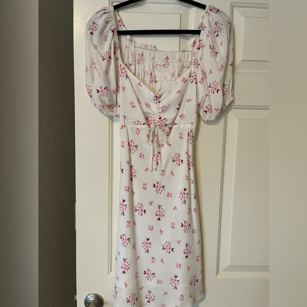 Cotton candy LA puff sleeve white mini dress w/ open back & pink floral pattern